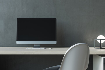 Poster - Close up of contemporary mock up computer screen at modern designer office workplace in interior. Concrete wall background. 3D Rendering.