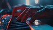 Close-up of a person's fingers playing piano with dramatic blue and red lighting