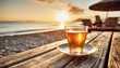 a glass of tea on the rustic wooden table in front of beautiful beach on golden sunset generative ai