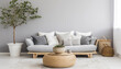 Stylish living room interior with gray sofa pillows coffee table and decorative potted plant in white pot next to it