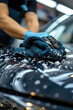 a man wipes a car with a rag close-up