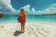 Woman enjoys summer vacation on a tropical beach by the clear blue sea
