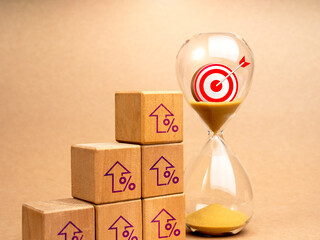 Poster - Business success process and marketing goals plan concepts. 3d Target icon in hourglass near wooden cube blocks growth graph steps with rising percentage arrow symbols, minimal background.