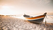 Colorful Small Wooden Fishing Boat On Beach Summer And Vacation