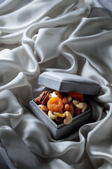 Wall Mural - Dried fruits and nuts in a gift box.