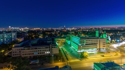 Wall Mural - Aerial panorama of Moscow day to night transition timelapse from rooftop. Traffic on the road. Skyscrapers, Kremlin towers and churches, stalin houses on background at evening in Moscow, Russia.