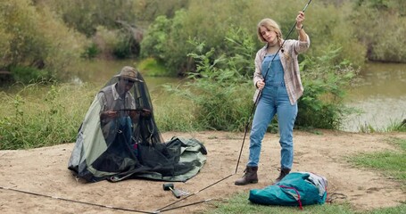 Poster - Man, woman and tent or setting up in forest for camp site, wilderness and nature and relaxation. Couple, pitching or hand or high five for hiking in park, woods or recreation with trees for adventure