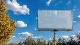 Fototapeta  - Blank billboard on blue sky ready for new advertisement beside highway