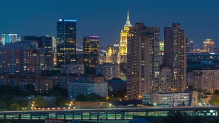 Wall Mural - Aerial cityscape skyline with World Trade Center towers and hotel Ukraine day to night transition timelapse in Moscow. WTC is the biggest business center in Russia. Cloudy sky and traffic on the road