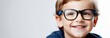 Portrait of a little boy wearing glasses on a white background with space for text