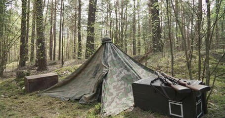 Wall Mural - Wermacht German Military Field Tent. Concept Of Military Rest Stop. Rifles Lie On Ammunition. Carabines Mauser 98k During Ww2. Old Vintage German Infantry Army Helmet. Autumn Reenactment Tactic Game.