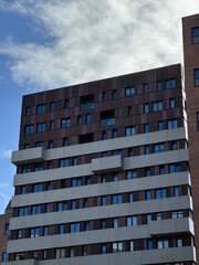 Canvas Print - Looking up at modern buildings with a blue sky background. Taken in Manchester england. 