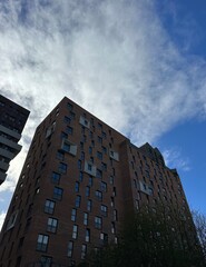 Poster - Looking up at modern buildings with a blue sky background. Taken in Manchester england. 