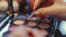 Detailed View Of A Makeup Brush Applying Shimmering Eyeshadow.