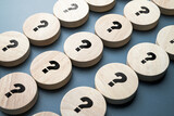 Fototapeta  - Many question marks on round wood blocks arranged in the rows, many questions need the answers, system, processing, test, or FAQS concept