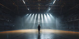 Fototapeta Fototapety sport - A basketball player in an empty basketball court is illuminated by spotlights, creating dramatic lighting effects. An empty basketball arena or stadium with spotlights, polished wood, and fan seats.