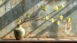   A vase of flowers resting on a windowsill with a shadow on the adjacent wall