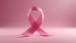 © Kh - World cancer awareness day concept with 3D pink ribbon in pink backdrop