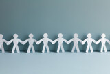 Fototapeta Panele - Paper human chain holding hands together on clean and clear pastel color background, teamwork concep