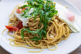 Fototapeta Desenie - Italian spaghetti del poverello (Poor Man's Spaghetti), spaghetti pasta mixed with a lightly fried egg. Egg and cheese pasta, healthy food