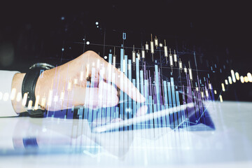 Poster - Abstract creative financial graph with finger clicks on a digital tablet on background, forex and investment concept. Multiexposure