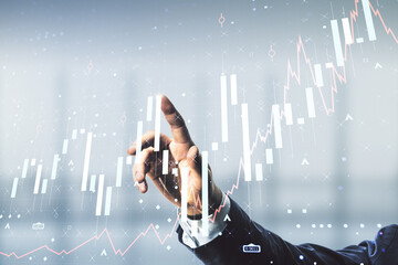 Poster - Multi exposure of man hand with pen working with abstract virtual financial graph on blurred office background, forex and investment concept