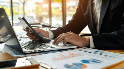 Poster - the businessman or accountant is working on his laptop computer with a business document, graph diag