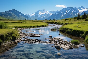 Canvas Print - Alpine valley with river and mountains in the distance