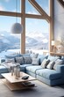 Blue sofa in a modern living room with a view of the snowy mountains