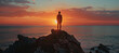 Back view photo of Man standing on top of cliff at sunset