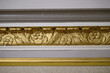 gold crown molding with flowers and leaves