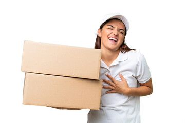 Wall Mural - Delivery caucasian woman holding boxes isolated on green chroma background smiling a lot