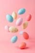 Colorful eggs floating on a pastel pink background. Abstract minimal Easter concept.	