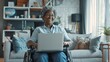 Woman with Laptop in Wheelchair