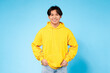 Casual young guy in vibrant yellow hoodie