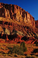 Wall Mural - Sunrise on the spectacular geological layers of the Scenic Drive of Capitol Reef National Park, Utah, Southwest USA.