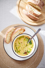 Wall Mural - Bowl of potato soup with parsley and bacon with toasted bread croutons in white bowl. Comfort meal