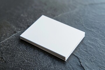 Poster - A square white piece of paper on a table, suitable for office or education concepts