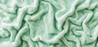An expanse of soft terrycloth fabric texture in a fresh, seafoam green. 32k, full ultra HD, high resolution