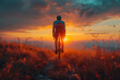 Silhouette of a cyclist on a gravel bike riding on a gravel trail at sunset.