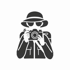 Aufkleber - A man in a hat capturing a moment with a camera. Suitable for photography themes