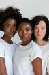 An emotive image of a diverse trio of women, their faces close and expressions serene, in a moment of shared solidarity and quiet strength, reflecting the unity within diversity.