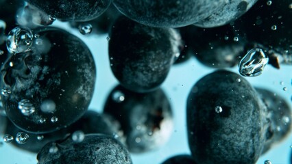 Fototapete - Macro shot of blueberries in the water.