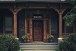 A craftsman house with a dark exterior, featuring a beautifully carved wooden door and matching window frames.