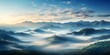 Foggy mountains landscape. Panoramic view of foggy valley.