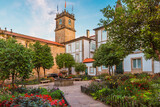 Fototapeta Morze - Small square in Santiago de Compostela city with flower garden and fountain, Galicia, Spain. Popular touristic landmark