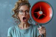 An astonished woman with curly hair and round glasses yelling into a red megaphone with an intense expression