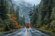 The iconic red truck travels a wet forest road amidst fog and lush autumn foliage, signifying journey and exploration