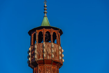 Poster - Wooden minaret in Sarajevo during a sunny day