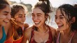 A group of young women in sportswear, laughing and posing for a photo after a workout. They are all sweaty and glowing, and their hair is windblown.